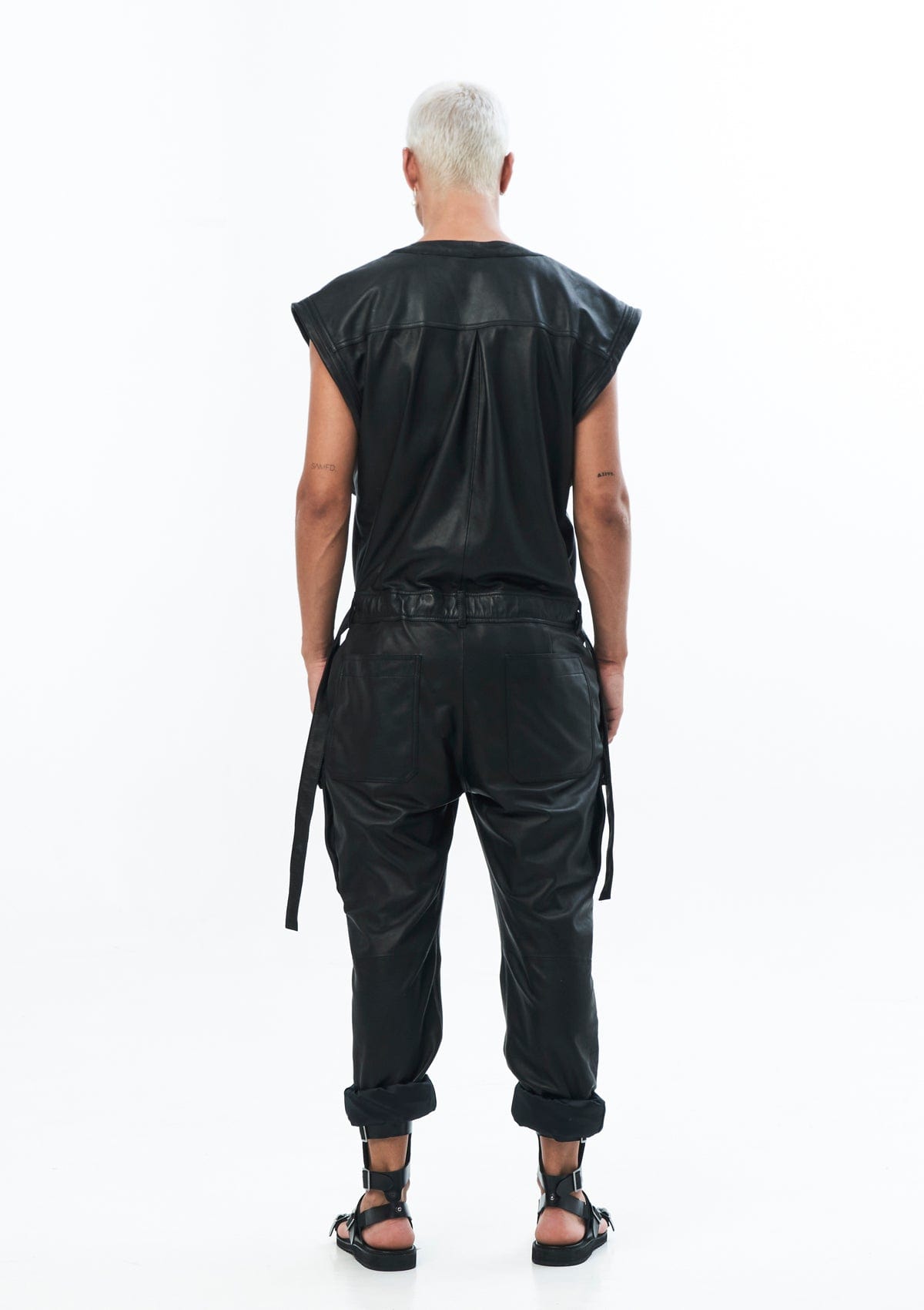 SLEEVELESS LEATHER JUMPSUIT IN BLACK – JONNY COTA